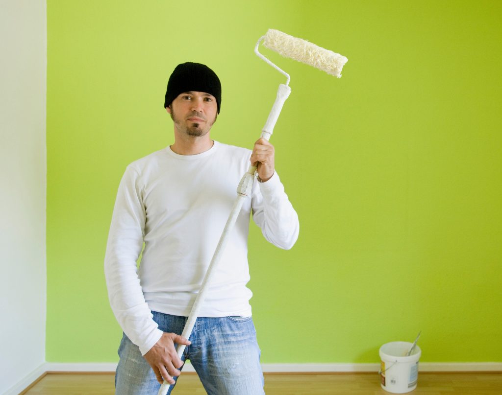 Man painting the wall